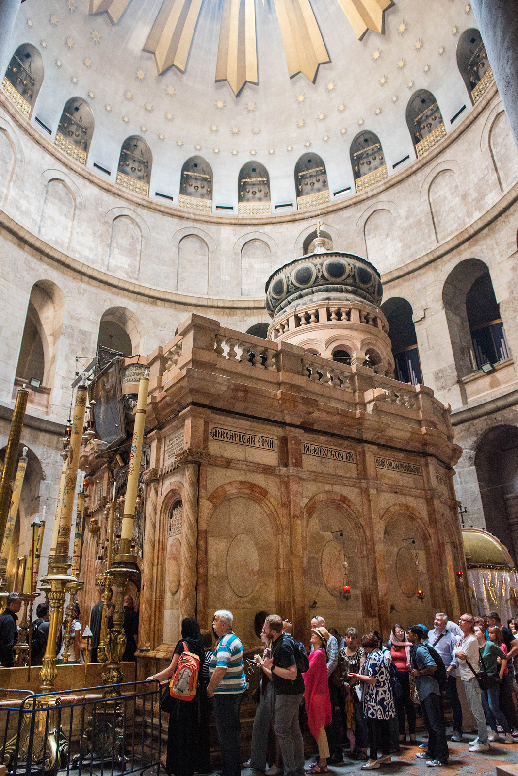 JERUSALEM, ISRAEL - MAY 15, 2018: Pilgrims worshipping the Stone of Unction, the place where the body of Jesus was laid down, after the crucifix. Church of the Holy Sepulchre